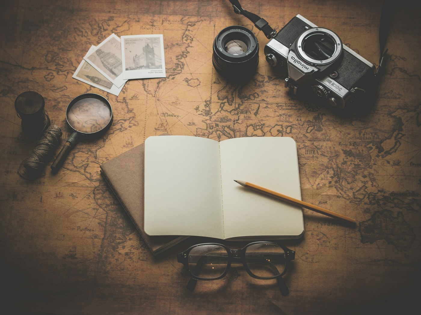Someone planning a trip on paper